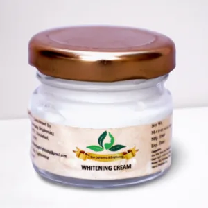 Small transparent glass jar with golden lid labeled Whitening Cream from Skin Lightening & Brightening brand.
